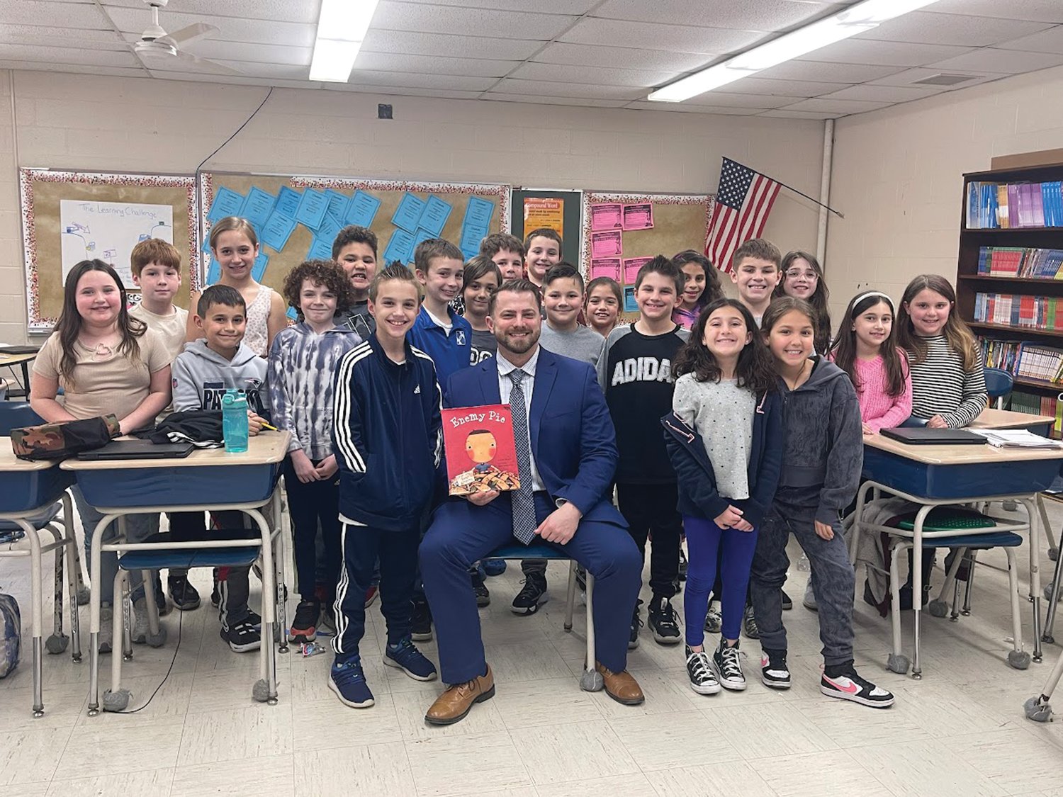 HIGH SCHOOL TRAINING: Now former Johnston High School's Assistant Principal Matthew Velino, who has been promoted to the JHS’s top administrative post, Principal, visited third grade students for Read Across America. He read the book, “Enemy Pie” by Derek Munson.